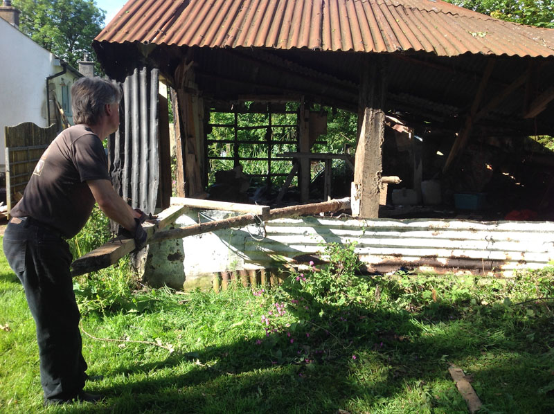 Demolishing the old barn